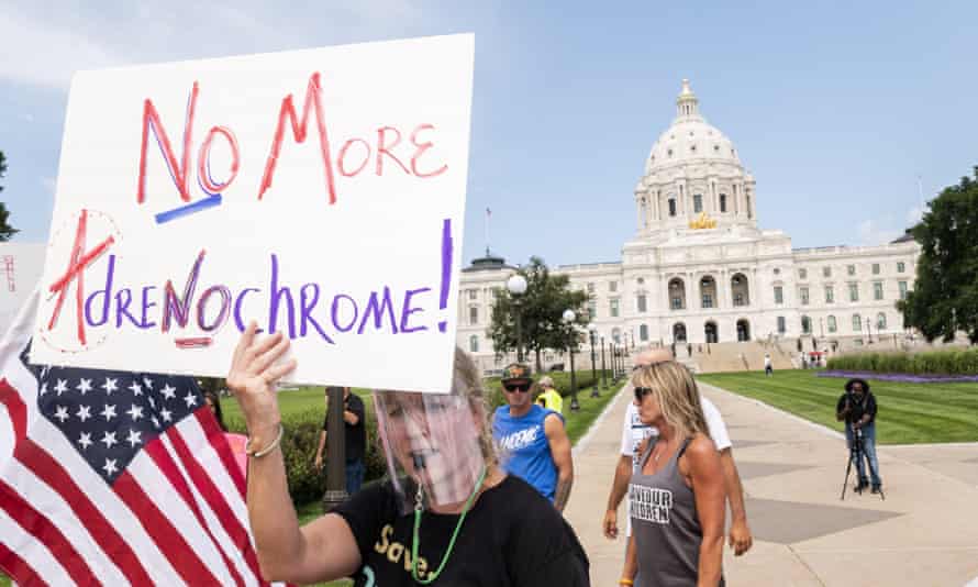 People march during a ‘Save the Children’ rally outside the Capitol building on 22 August in St Paul, Minnesota.
