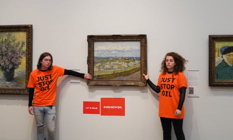 Just Stop Oil activists Louis McKechnie and Emily Brocklebank glue themselves to van Gogh’s Peach Trees in Blossom at the Courtauld Gallery on 30 June.