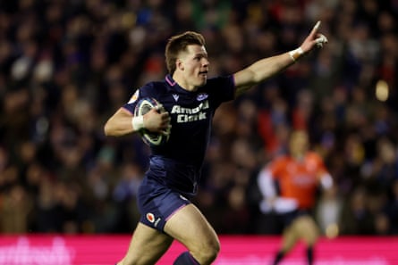 Huw Jones celebrates as he runs in Scotland’s fourth try