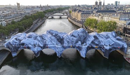 It’s a cover-up … La Caverne du Pont Neuf by French street artist JR.