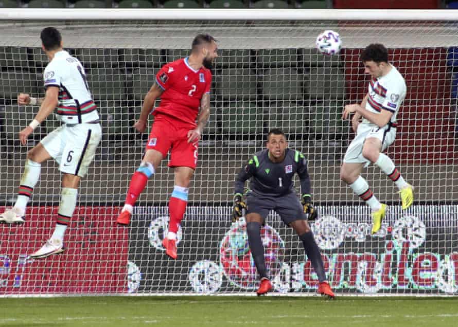 Diogo Jota, right, leaps to scoring against Luxembourg.