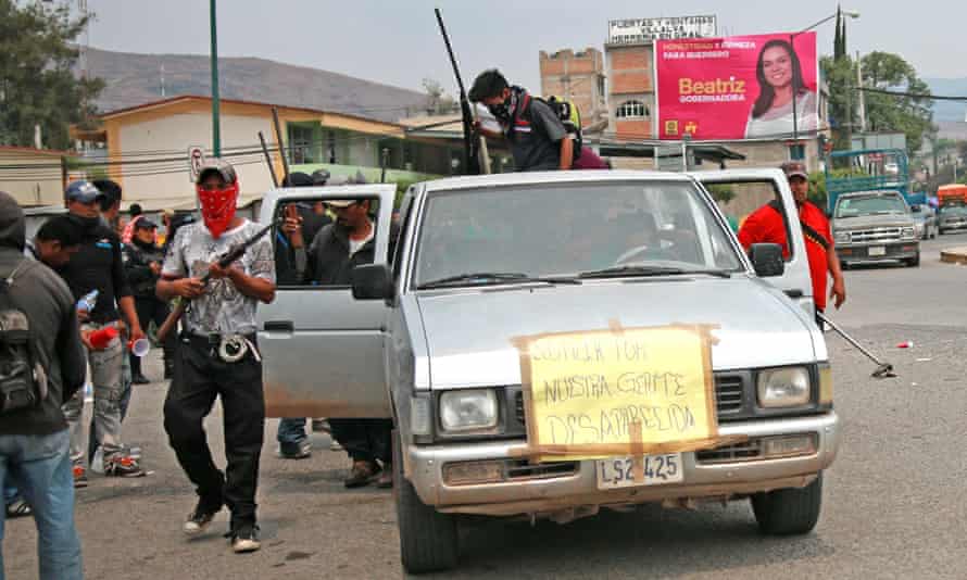 Armed civilians patrol the town of Chilapa, Mexico.