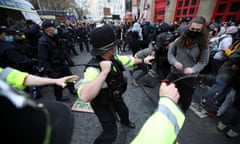 Police and protesters in Bristol on 21 March 2021. Photograph: Peter Cziborra/Reuters