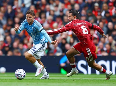 James McAtee of Nottingham Forest skips past Dominik Szoboszlai of Liverpool.
