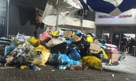 Piles of waste and trash are accumulated in front of al-Shifa Hospital in Gaza City on 13 November