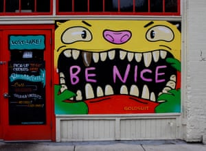 A ‘Be Nice’ mural graces Lost Lake Café, by Goldsuit