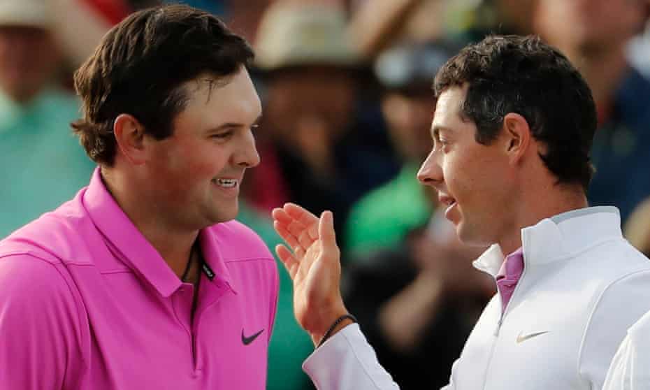 Patrick Reed, left, is congratulated by Rory McIlroy after holding his nerve as his playing partner faltered to win the Masters.