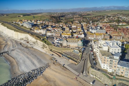 Rottingdean beach and high street with the South Downs in the background.
