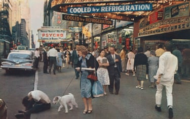 busy 42nd Street scene where advertising signs include a cinema showing Psycho