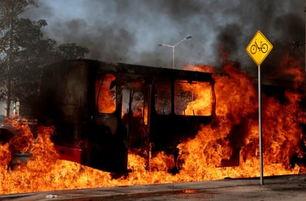 A bus set on fire by organised crime groups in response to an operation in Jalisco to arrest a high-priority security target, burns at one of the main avenues in Zapopan, state of Jalisco, Mexico