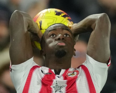 Michael Kayode winds up for a trademark long throw against Spurs