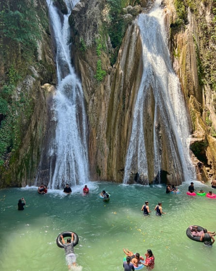 Kempty Falls near the town of Mussoorie, Uttarakhand. People are cooling off in the waters below.