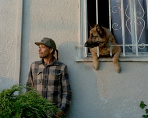 Jose Garcia, the safety specialist coordinator for Oakland unified school district’s newcomer students, outside his Fruitvale home with his dog Rollo.