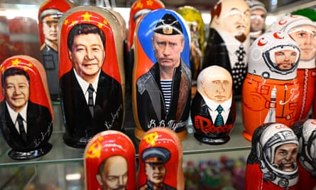 Traditional Russian wooden matryoshka dolls depicting Xi Jinping and Vladimir Putin at a gift shop in central Moscow