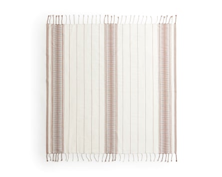 An H&M white and pale brown Jacquard-weave beach towel with tassels on a white background
