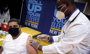 Eugenio Brito, Vice President of Bodegas of America receives a Pfizer vaccination shot at an event to announce five new walk-in pop-up vaccination sites for New York City Bodega, grocery store and supermarket workers amid the coronavirus disease (Covid-19) pandemic, in the Harlem section of Manhattan in New York City, earlier today.