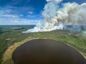 Smoke rises from a wildfire northwest of Fort McMurray