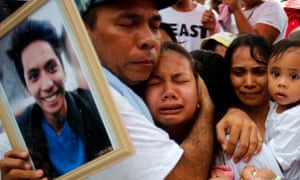 Relatives mourn Ephraim Escudero, the victim of an extrajudicial killing, in San Pedro city, Philippines.