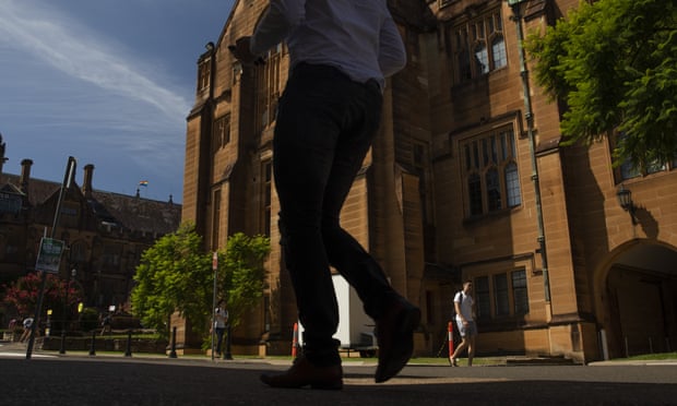 Students walk past a building at the University of Sydney
