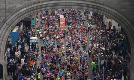 Runners cross Tower Bridge during the London Marathon