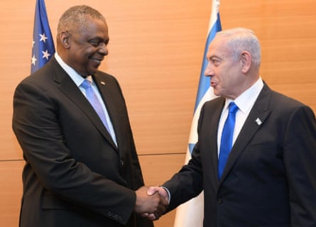 Benjamin Netanyahu and Lloyd Austin shake hands