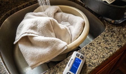 A Quince Towel being soaked in a sink