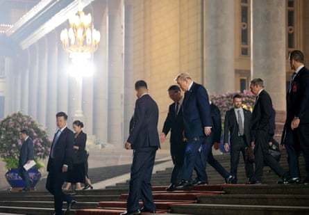 Trump walks outside the Great Hall of the People after attending a state banquet with Xi Jinping in Beijing.