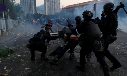 Riot police clash with protesters in the Sha Tin district of Hong Kong.