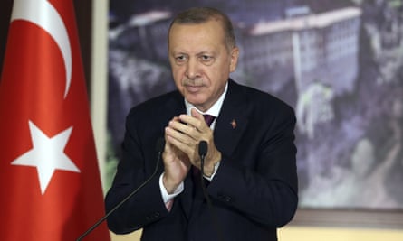 Turkey’s President Recep Tayyip Erdoğan applauds lawmakers in Istanbul in July before voting on the social media bill.
