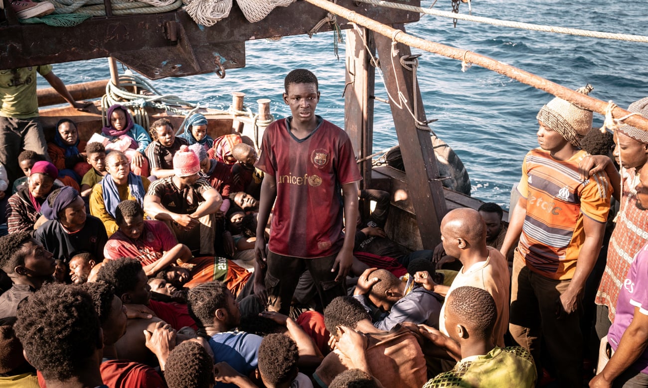 Still from film: migrants on crowded boat