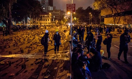 Protesters gather on a blocked road in Hong Kong