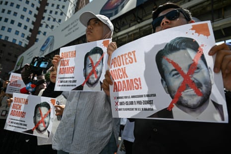 Malaysian protesters display placards during a demonstration against the US envoy nominee Nick Adams outside the US embassy in Kuala Lumpur.
