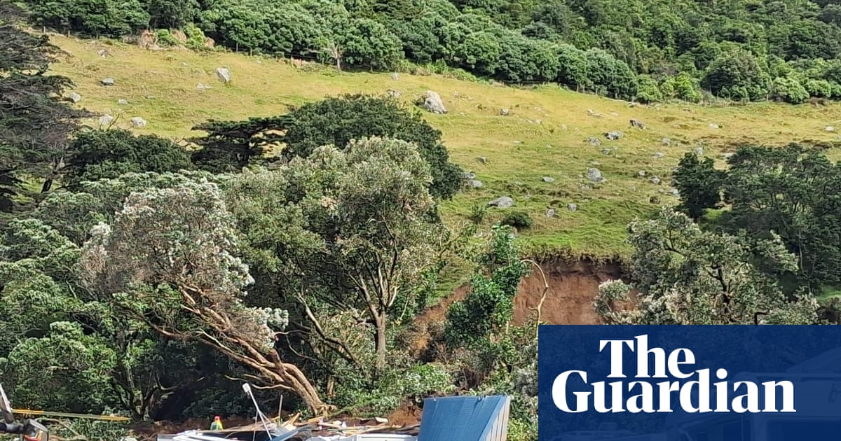 New Zealand storms: people missing after landslide hits campsite as minister compares east coast to ‘war zone’
