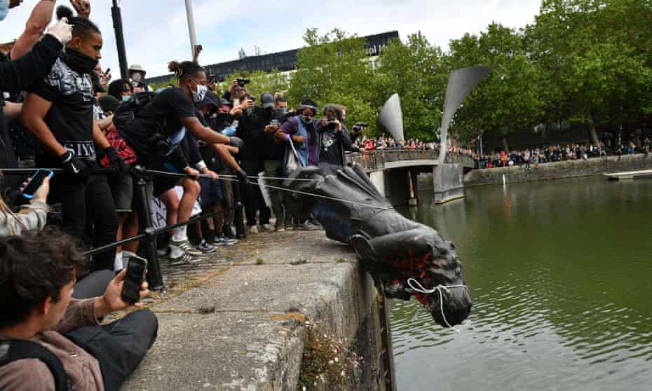 Protesters throwing a statue of Edward Colston into Bristol harbour, June 2020