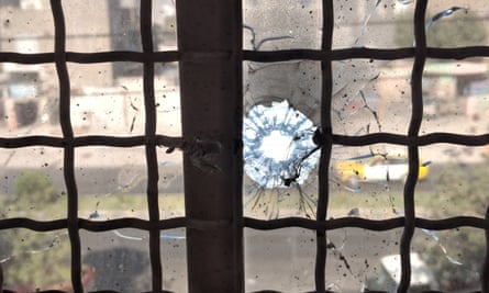 A bullet hole in the window where Akhtar Mohammad Makoii used to sit to write