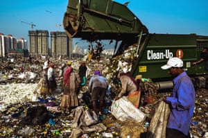 The Mulund dump is the second largest waste disposal facility in Mumbai. The garbage piles are as high as 28 metres. A group of rag pickers scavenge for plastic and metals from the waste unloaded from garbage trucks. None of the workers wears gas masks or gloves.