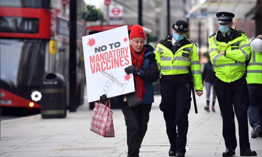 A protestor attending an anti-vaccine demonstration outside the offices of the Bill and Melinda Gates foundation in central London today. (There is no government plan to make vaccination mandatory.)