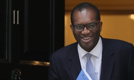 Kwasi Kwarteng leaves 11 Downing Street in London before delivering his mini-budget statement in the House of Commons.