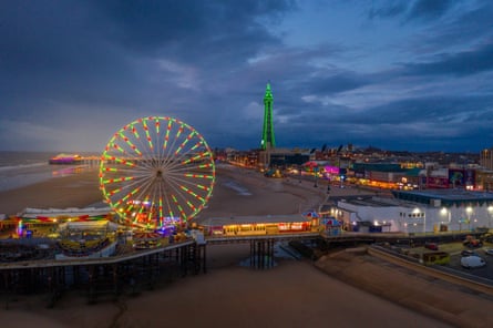 Blackpool pier with big wheel illuminated at night