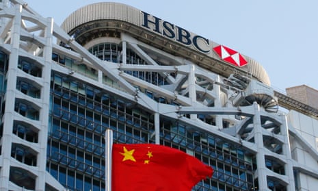 A Chinese national flag flies in front of HSBC headquarters in Hong Kong, China