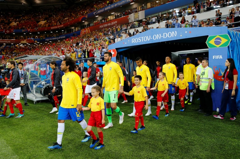 The players walk out onto the pitch.