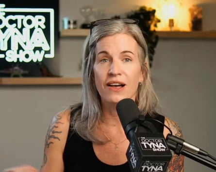 She sits in front of a microphone