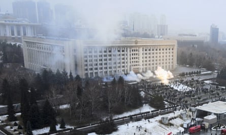 Smoke rises from the city hall in Almaty