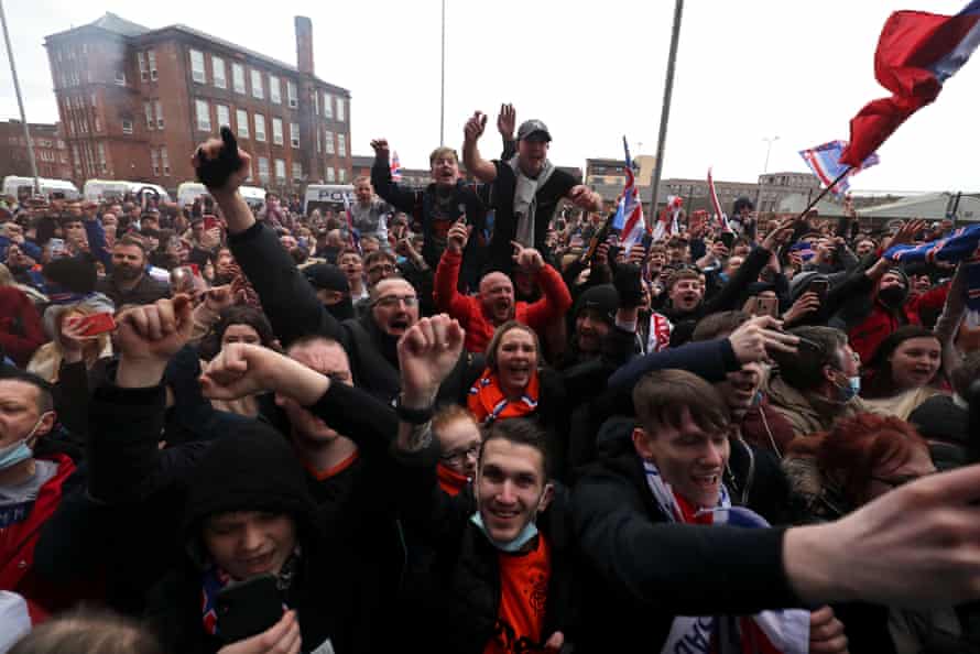 Rangers fans celebrate outside the ground.