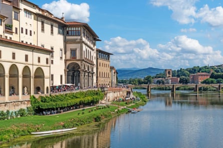 A wide river running through an ornate old town.