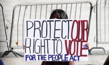 Voting rights activists rally outside Los Angeles’ city hall on 7 July. 