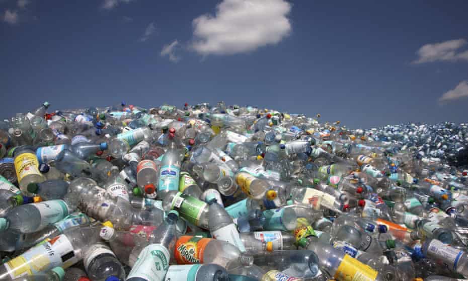 Pile of plastic bottles at a landfill site.