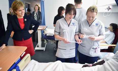 Nicola Sturgeon with students in a mock hospital ward in Queen Margaret university, Edinburgh.