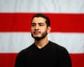 Man stands in front of American flag