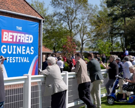 Racegoers on Guineas Friday of the Guineas festival at Newmarket racecourse